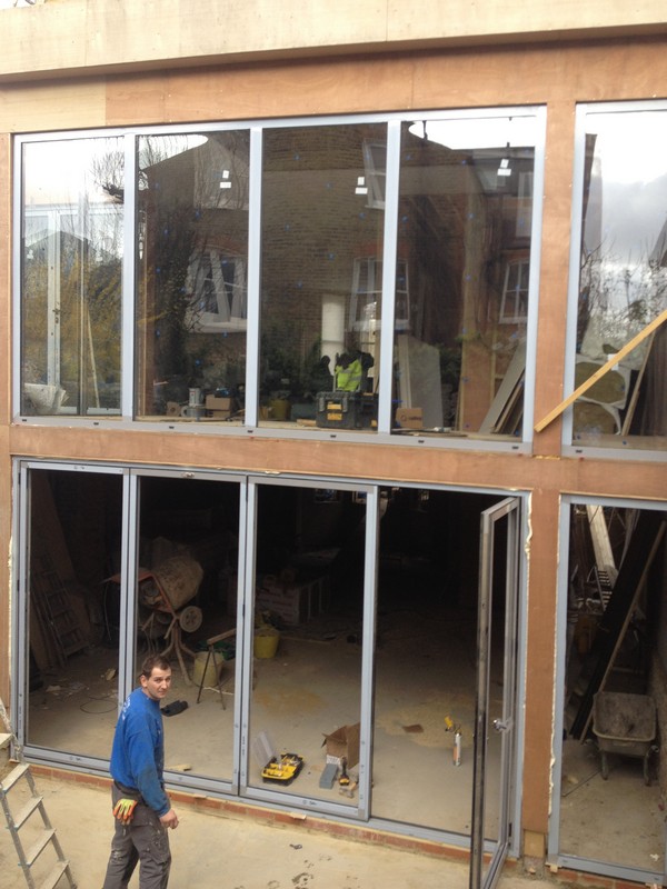 Aluminium bi-fold doors with two-storey glazing in Belgravia